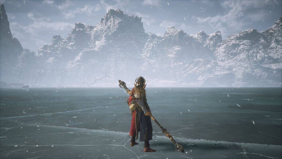 Wukong looking out across a frozen lake in Black Myth: Wukong.