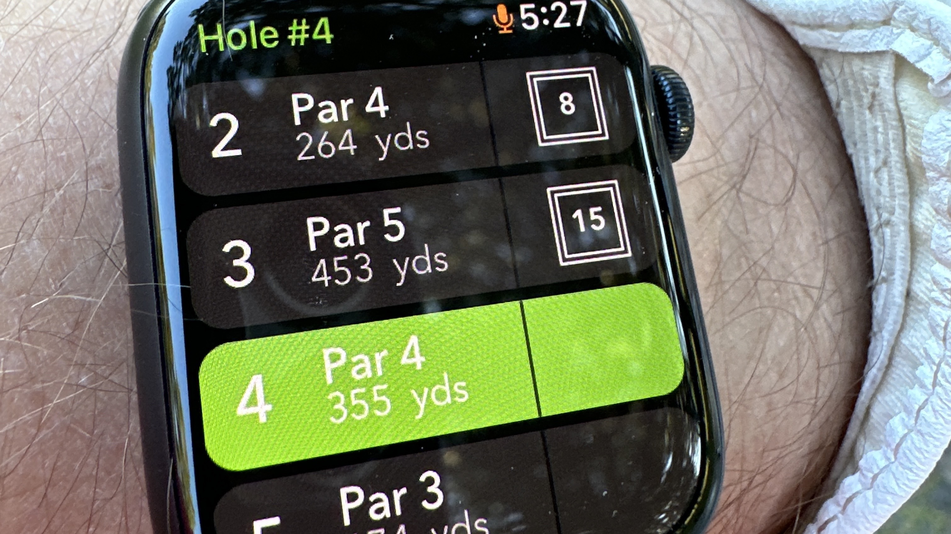 Person wearing the Apple Watch with Arccos golfing app displayed