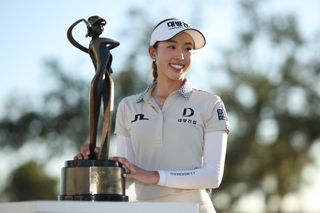 Yealimi Noh stands by the Founders Cup trophy