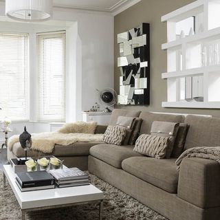 living room with white wall and sofa set with table