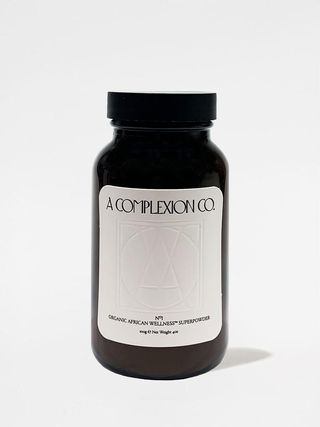 A Complexion Co African Wellness Supplement in brown glass bottle for all-in-one wellness