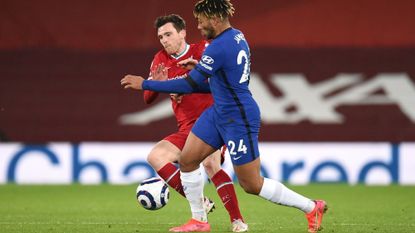 Andy Robertson of Liverpool battles for possession with Reece James of Chelsea 