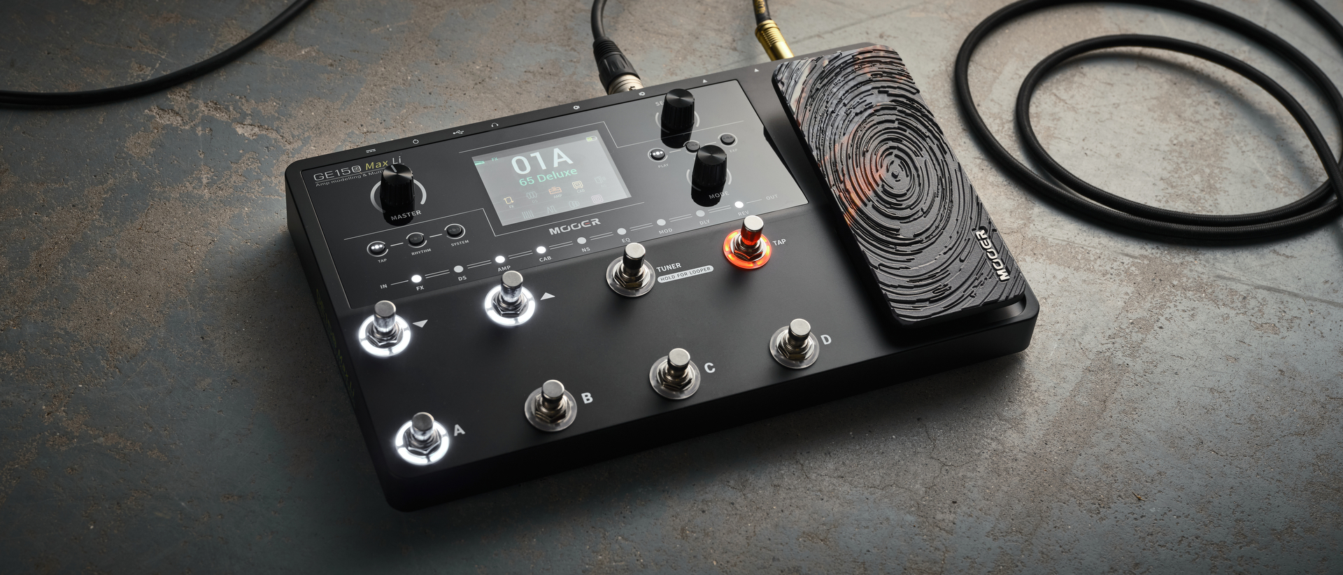 A Mooer GE150 Max Li multi-effects pedal on a concrete floor