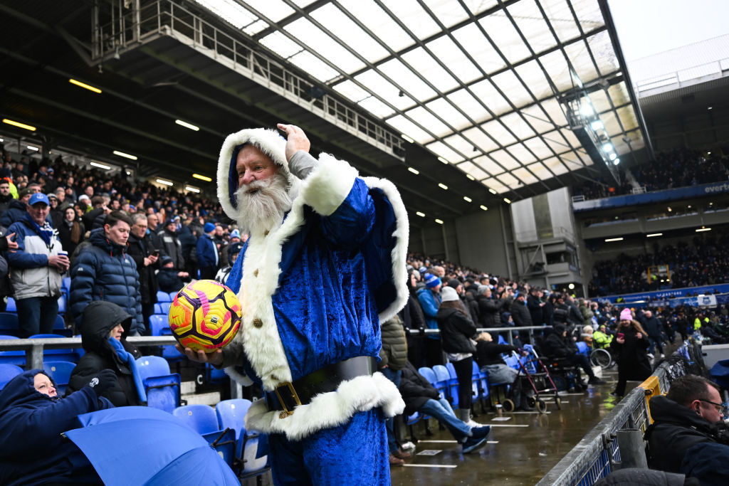 A fan dressed in a blue Father Christmas outfit at Everton's Goodison Park