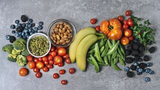 Fresh vegetables, fruits, and nuts - stock photo