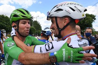 Team Deceuninck Quicksteps Mark Cavendish of Great Britain wearing the best sprinters green jersey L celebrates with Team Deceuninck Quicksteps Julian Alaphilippe of France after winning the 6th stage of the 108th edition of the Tour de France cycling race 160 km between Tours and Chateauroux on July 01 2021 Photo by POOL AFP Photo by POOLAFP via Getty Images