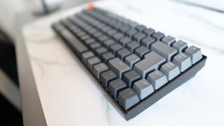 Image of the Keychron K2 gaming keyboard pictured on a desk.