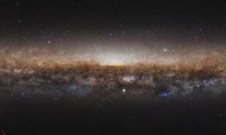 This new image, taken by the NASA/ESA Hubble Space Telescope, shows the incredible stretch of the galaxy NGC 5907, also known as the Knife Edge galaxy. This is a spiral galaxy, much like our home galaxy, the Milky Way. Though, you can’t see the galaxy’s brilliant spiral shape in this image as this image was taken facing the galaxy’s edge.