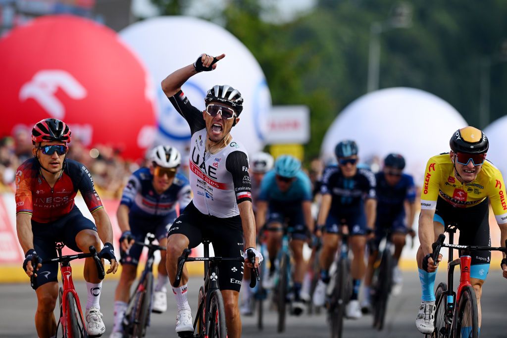 DUSZNIKIZDROJ POLAND JULY 31 Rafa Majka of Poland and UAE Team Emirates C celebrates at finish line as stage winner ahead of Micha Kwiatkowski of Poland and Team INEOS Grenadiers L and Matej Mohori of Slovenia and Team Bahrain Victorious Yellow leader jersey R during the 80th Tour de Pologne 2023 Stage 3 a 1623km stage from Walbrzych to DusznikiZdroj 668m UCIWT on July 31 2023 in DusznikiZdroj Poland Photo by Dario BelingheriGetty Images