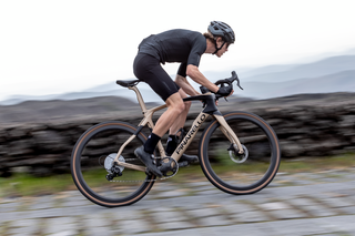 A man rides the new Pinarello Grevil on cobbled ground