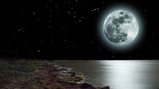 Full Moon June 2023: Rising of moon above a sea.
