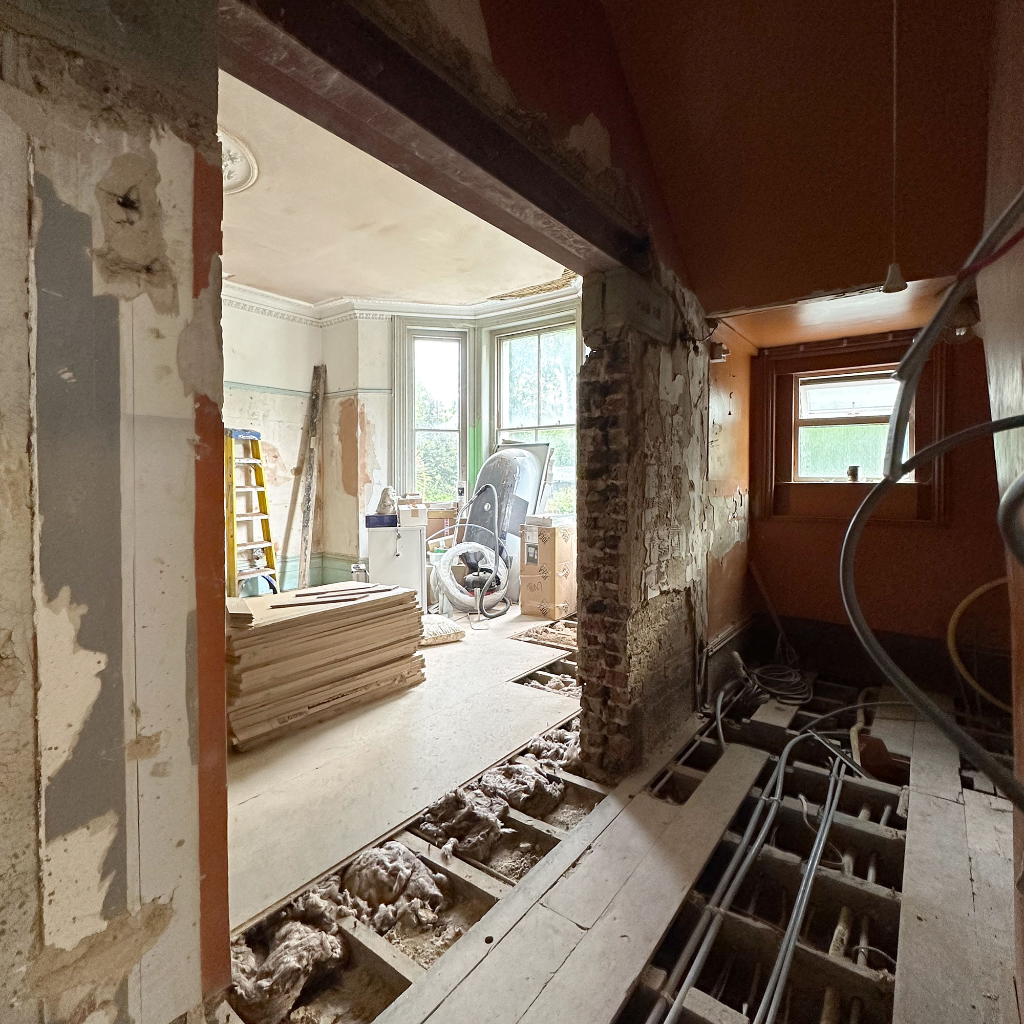 house mid renovation with no floors and bare walls