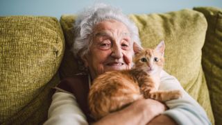 Woman cuddling her cat