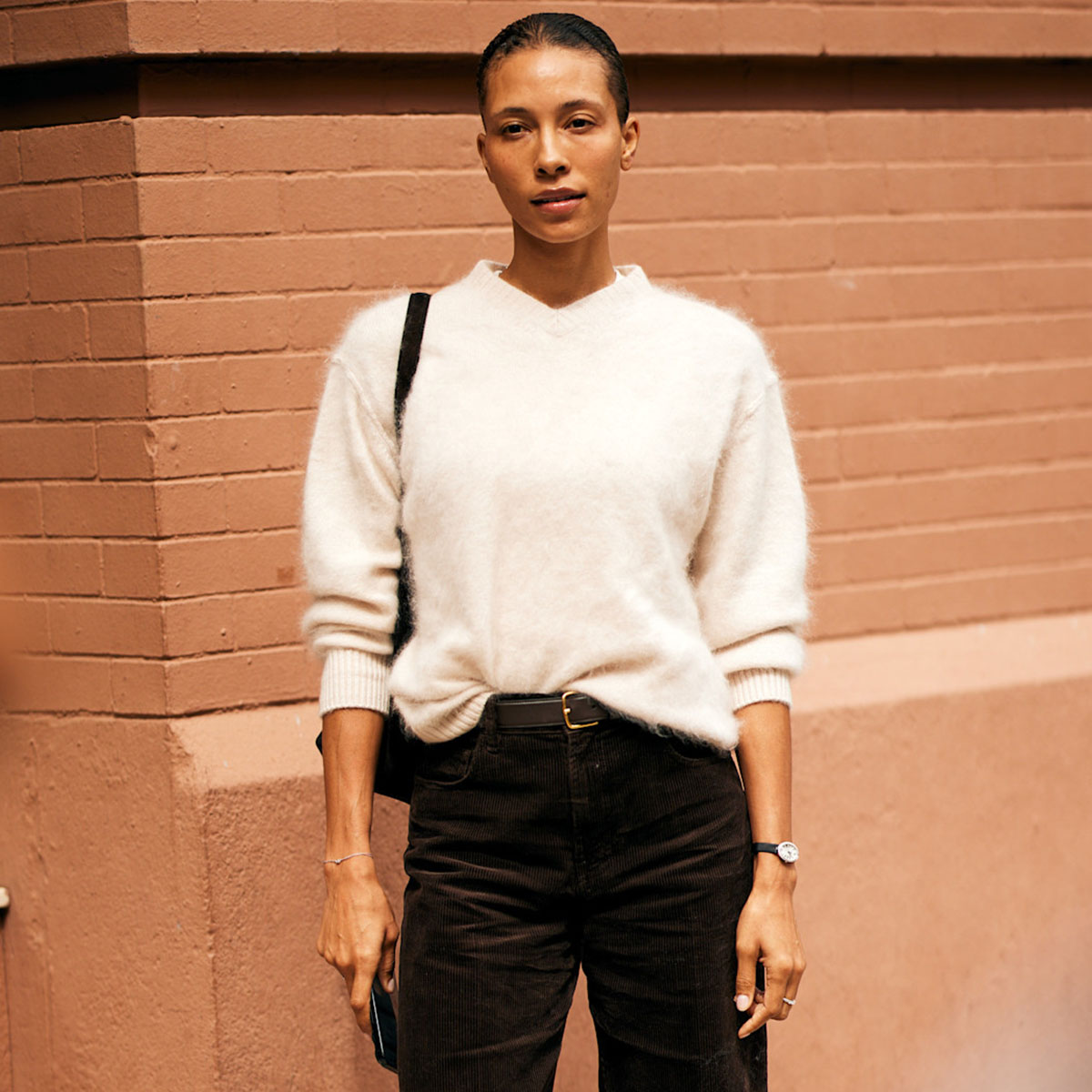 Woman in white V-neck sweater
