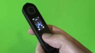 Telesin C40 Portable Smoke Machine remote held in a hand