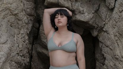 woman wearing sage colored knit bikini top