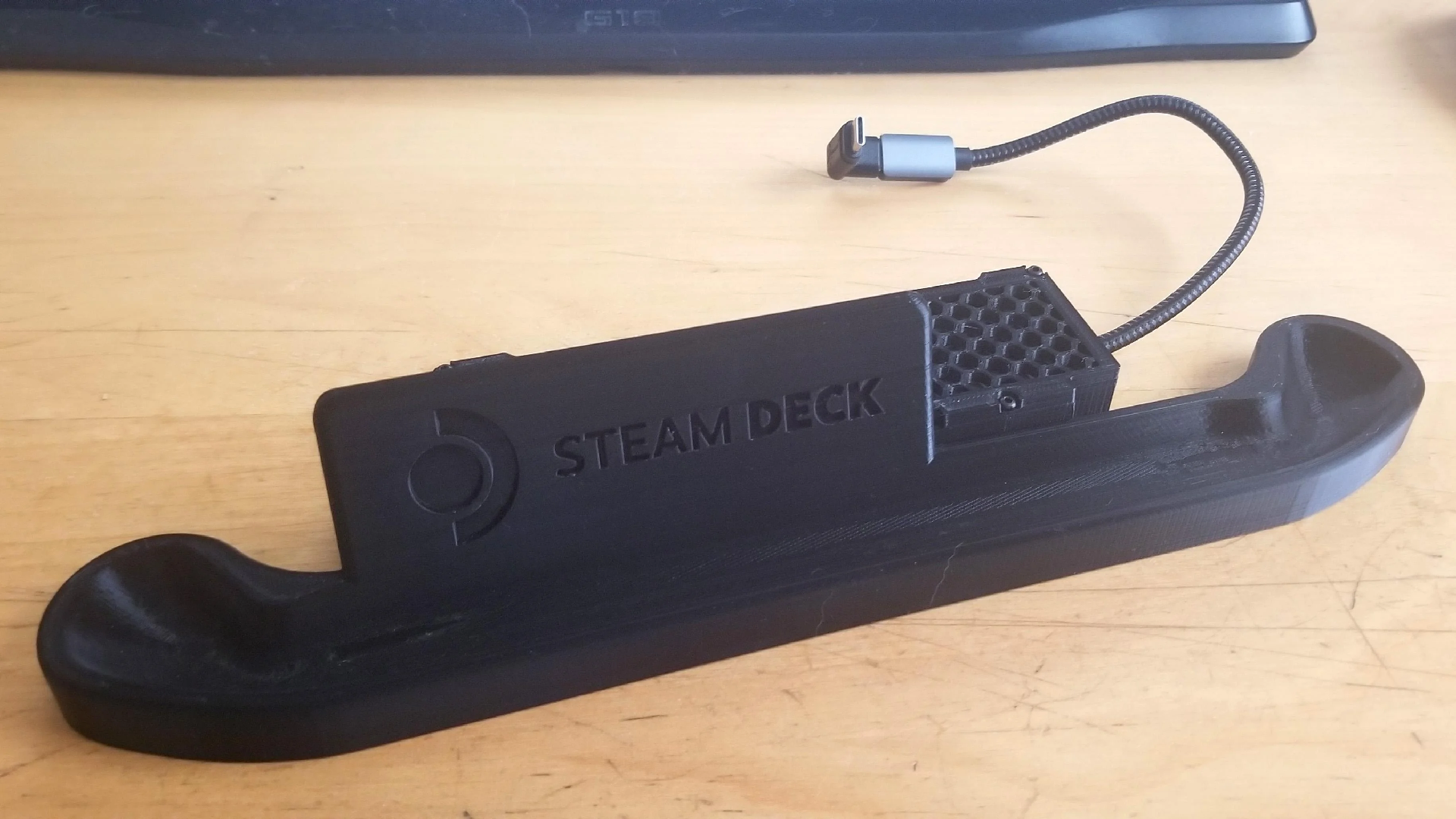 close up of steam deck resting in 3D printed dock