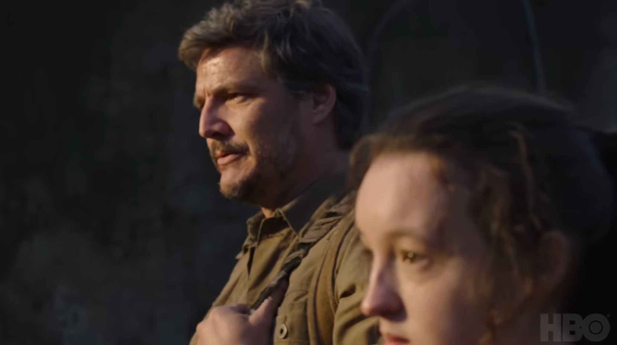 shot of Pedro Pascal and Bella Ramsey looking off to the left