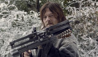 daryl with a crossbow in the snow