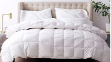 LaCrosse Premium Down Light Warmth Comforter on a bed.