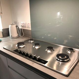 switch board with hot water kettle and wooden counter