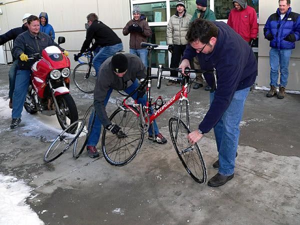 Ken Whelpdale of USA Cycling rolls in with a double flat.