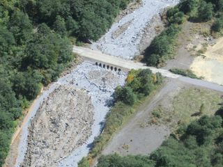 Ash chokes a river at Japan's Ontake volcano on Sept. 29.