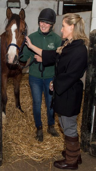 Duchess Sophie with a rescue horse during a visit to Remus Memorial Horse Sanctuary on October 14, 2015