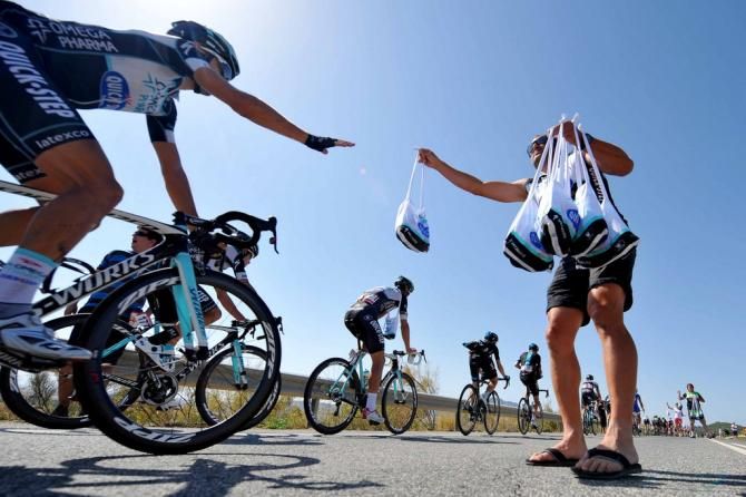 Omega Pharma-Quick Step riders pick up their musettes