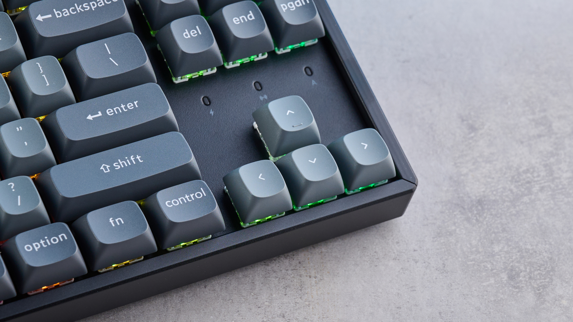 Keychron K8 Max mechanical keyboard in gray photographed on a blue background