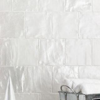 White satin-finish tile from Wayfair on a bathroom wall