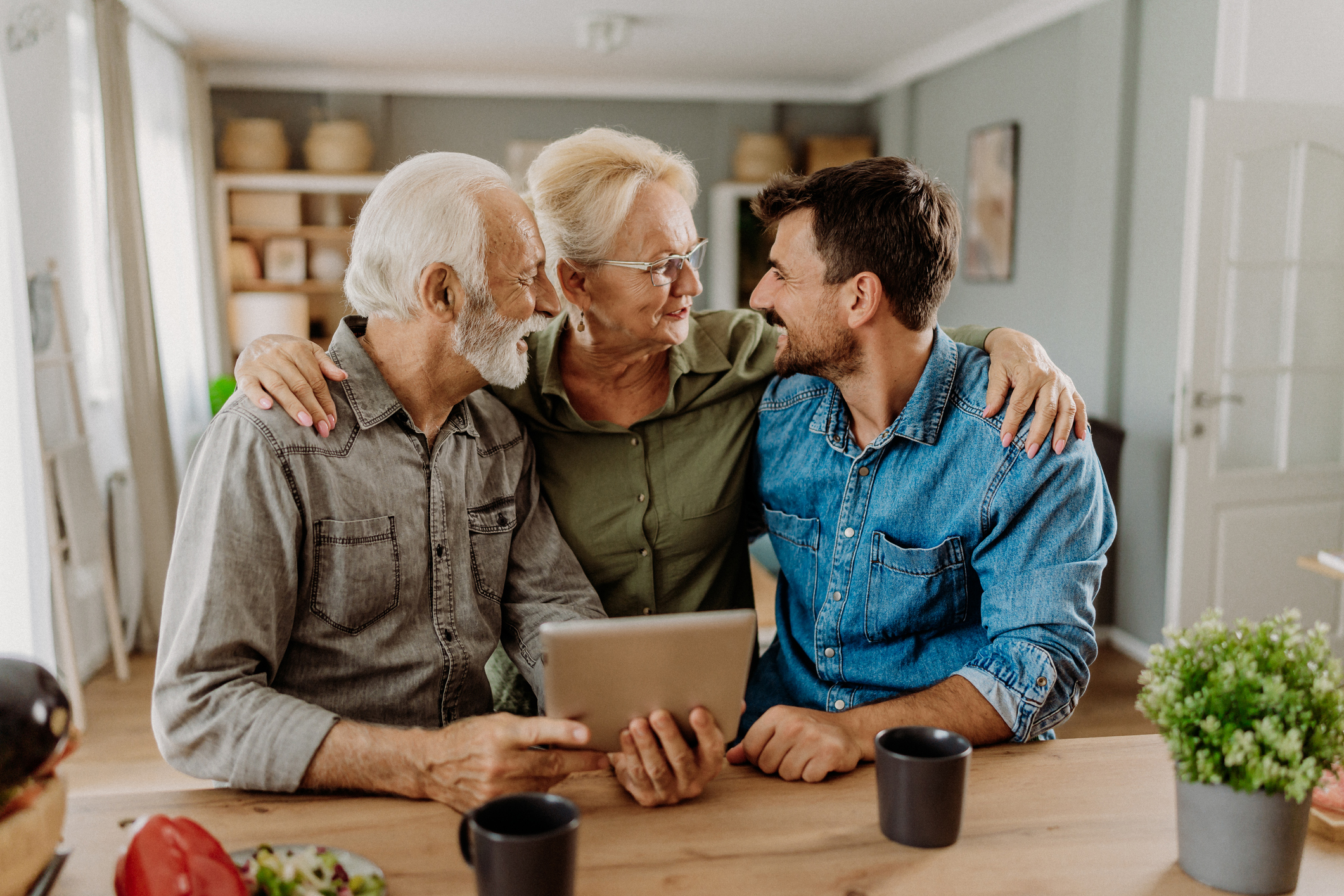 Older couple talking to their adult son