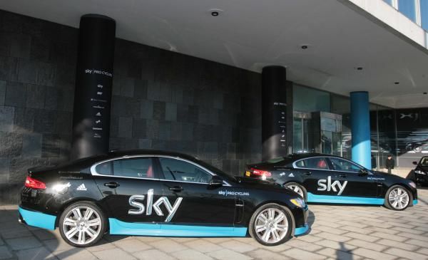 The Team Sky cars are a subdued black and blue.