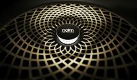 Illuminated speaker grille showing a Naim logo