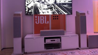 JBL modern audio AV receiver and stage 2 speakers playing Dolby Atmos soundtrack