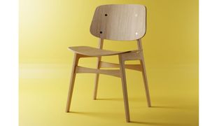 A wooden chair on a yellow background