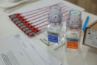 This photograph taken on July 5, 2024, shows anti-doping testing kit materials displayed at the International Testing Agency (ITA) testing facility inside a truck at the finish line of the 7th stage of the 111th edition of the Tour de France cycling race, 25,3 km individual time trial between Nuits-Saint-Georges and Gevrey-Chambertin. The overall leader yellow jersey rider and stage winner are systematically summoned to be tested for doping after the day's stage, along with any rider selected by ITA based on performance or intelligence from the organisation's investigative department. A chaperon escorts the rider to the facility where a supervised urine sample is collected for testing. (Photo by Thomas SAMSON / AFP)