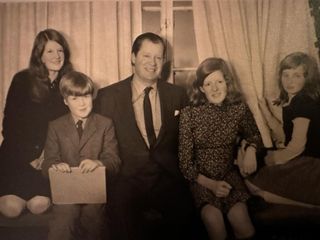 A black-and-white photo of Princess Diana with her family in 1972