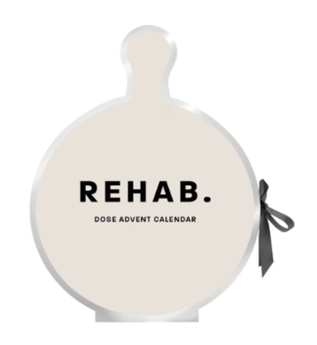 REHAB. Dose Advent Calendar with its contents in front of it