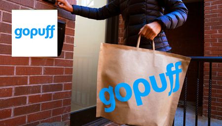 Gopuff service delivering a brown food bag to a customers door