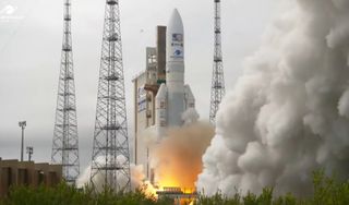 A rocket engine ignites on the launch pad