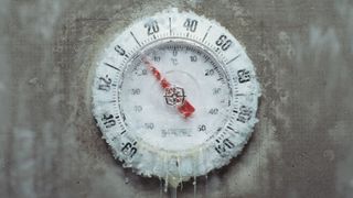 Ice covered thermometer, close-up.