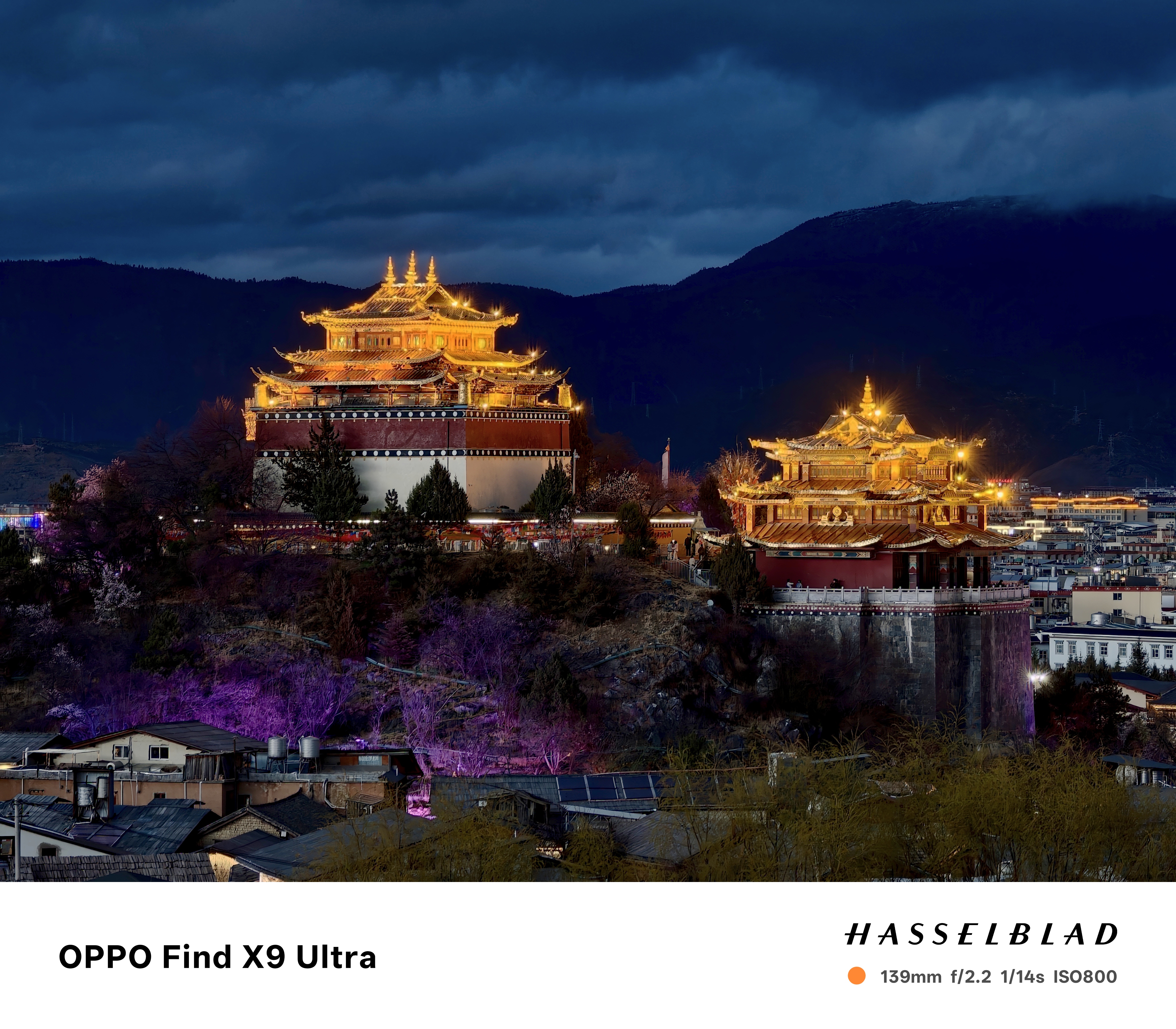 Monastery above a town at night, it's lit up