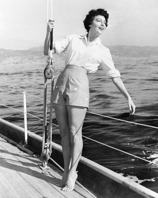 Ava Gardner poses on a sailboat