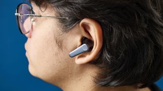 An EarFun Air Pro 3 wireless earbud in a person's left ear