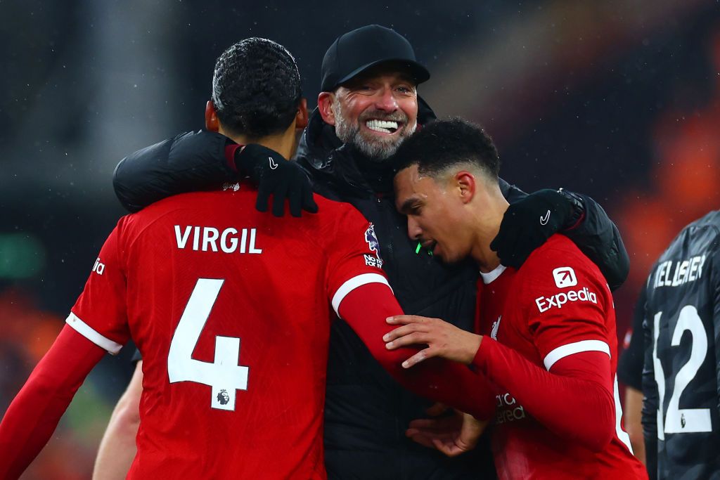 Liverpool manager Jurgen Klopp celebrates with Virgil van Djik and Trent Alexander-Arnold at full-time following the Premier League match between Liverpool FC and Fulham FC at Anfield on December 03, 2023 in Liverpool, England. (Photo by Chris Brunskill/Fantasista/Getty Images)