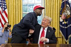 Former President Donald Trump and rapper Ye seen talking. 