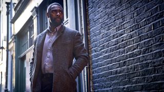John Luther (Idris Elba) in an alleyway in Luther: The Fallen Sun
