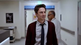 Zach Braff's JD walking down a hospital hallway in Scrubs revival