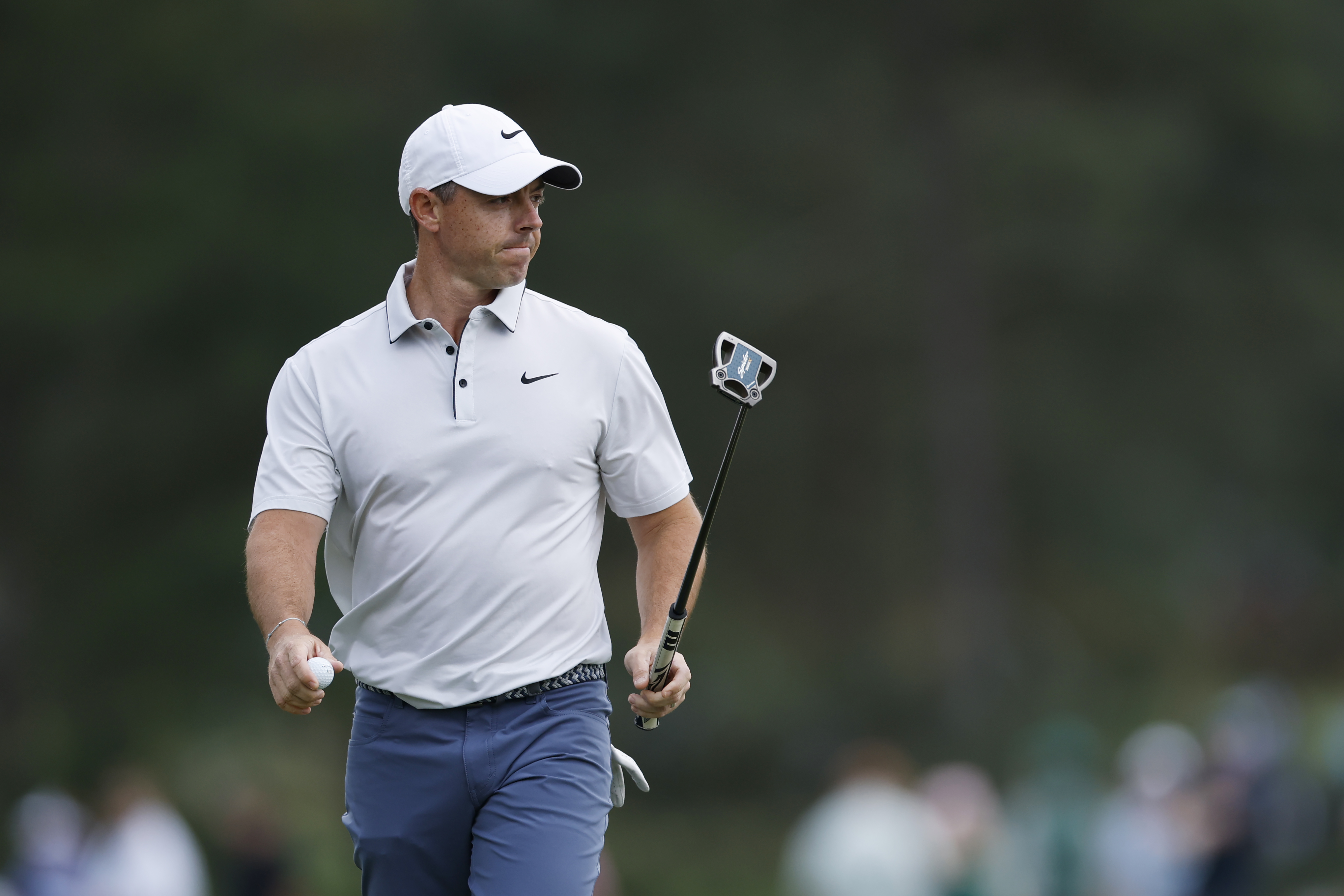 Rory McIlroy walks off the green